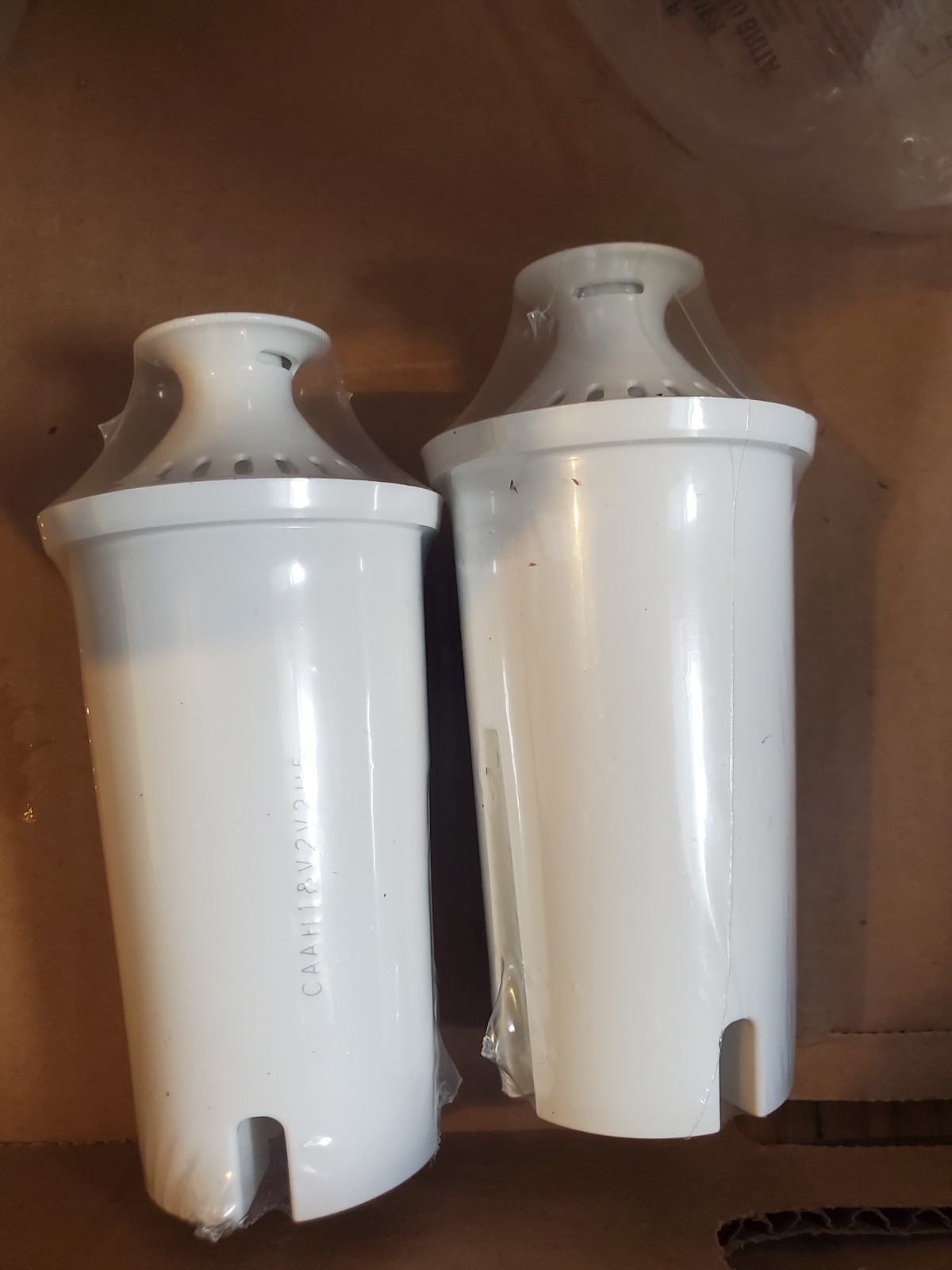 Two Brita filter pitchers with 2 extra new filters