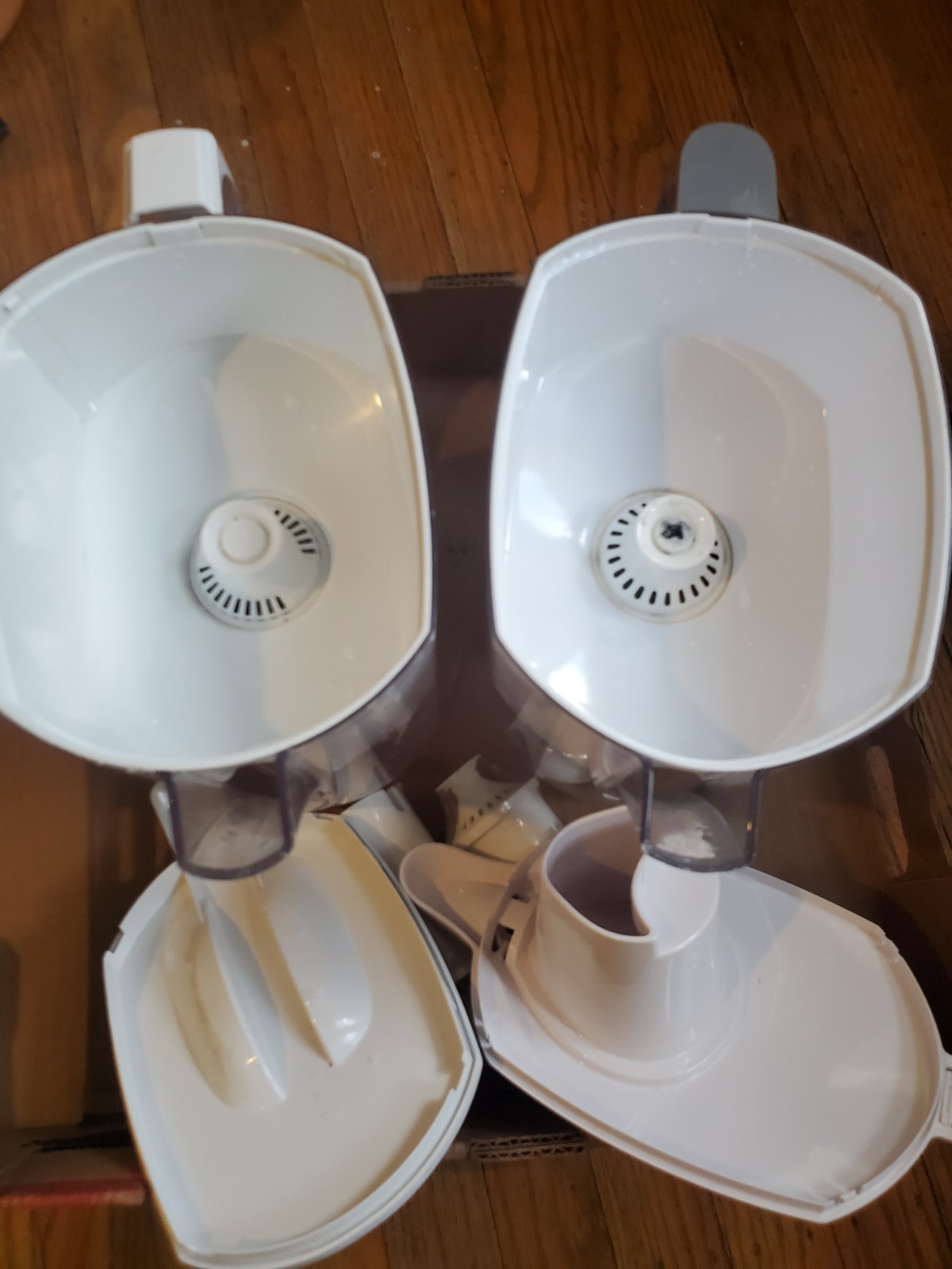 Two Brita filter pitchers with 2 extra new filters