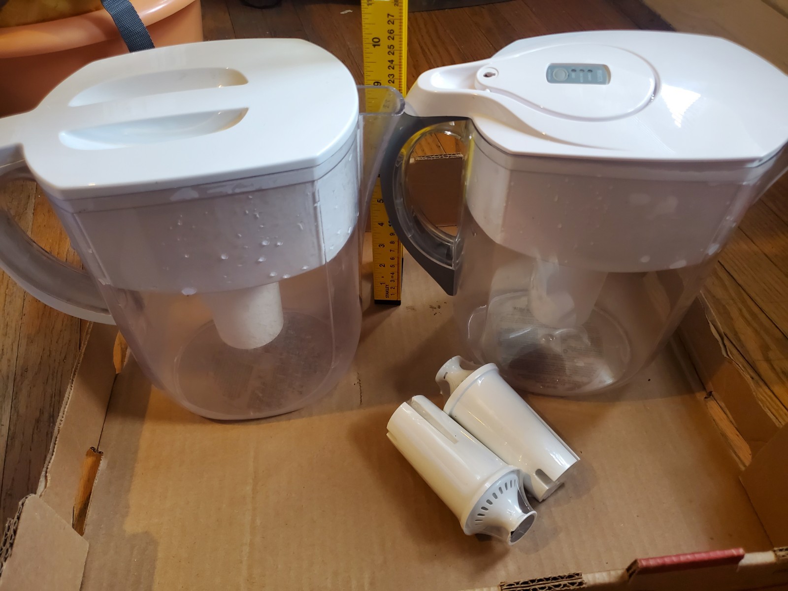 Two Brita filter pitchers with 2 extra new filters