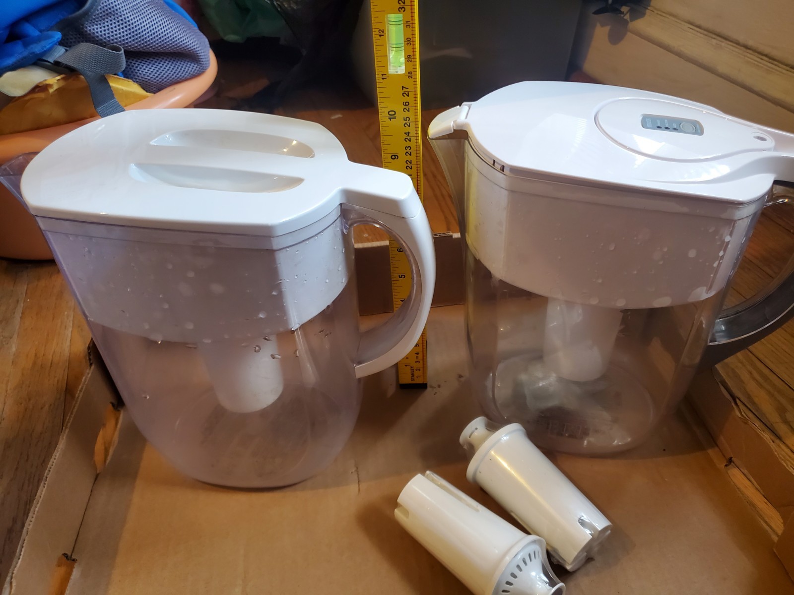 Two Brita filter pitchers with 2 extra new filters